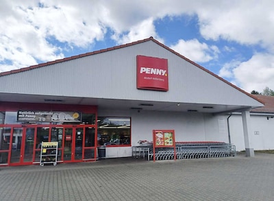 Sie sehen den Eingang vom Penny Markt in Alsdorf Grenzweg 82