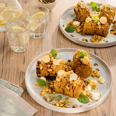 Dieses Bild zeigt den fertigen Buttermais mit Popcornbutter.